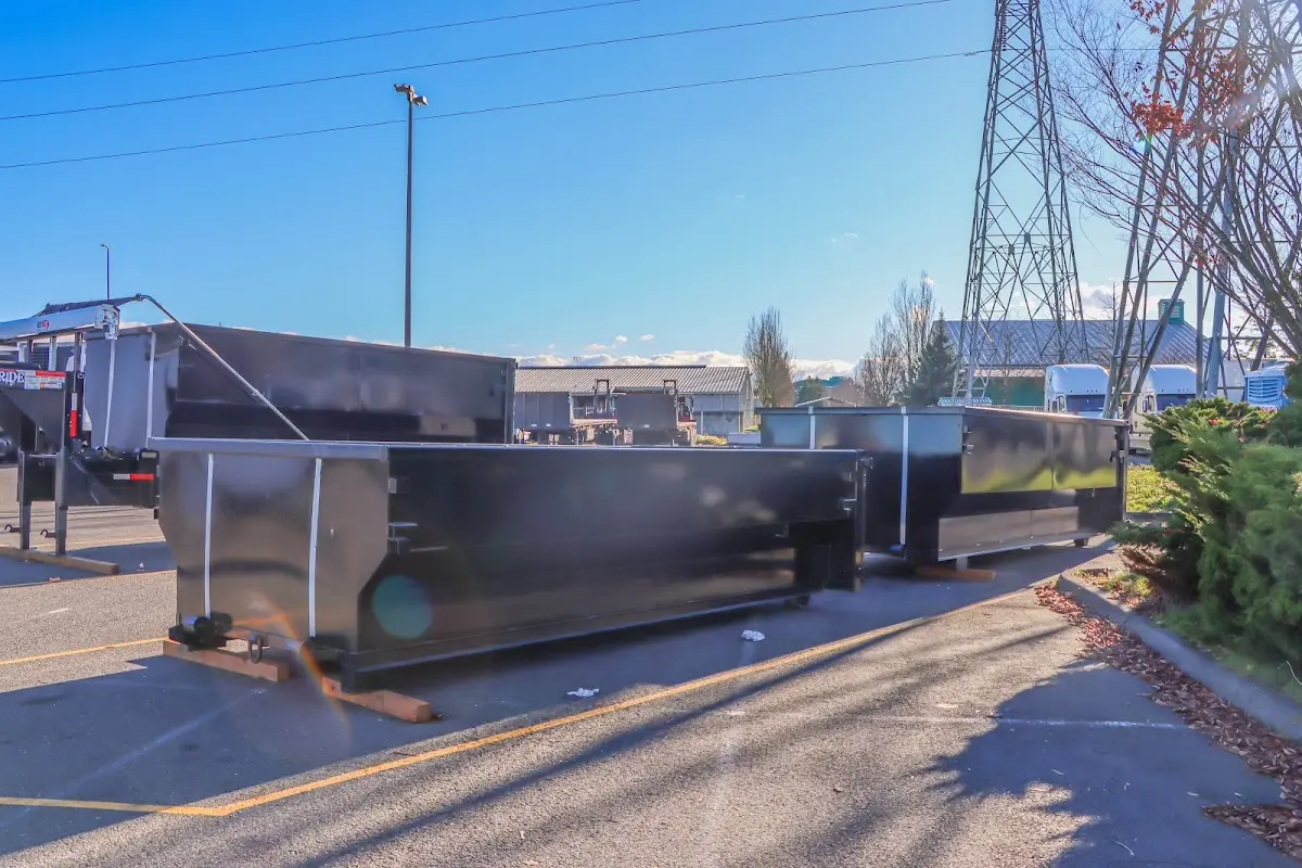 Roll-off dumpster ready for waste disposal at job site for Demolition Dumpster Rental in Rhinelander